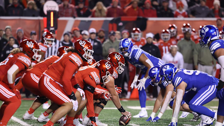 The Utah Utes offense lines up against the Brigham Young Cougars defense during the first quarter at Rice-Eccles Stadium. The Utah Utes offense lines up against the Brigham Young Cougars defense during the first quarter at Rice-Eccles Stadium.