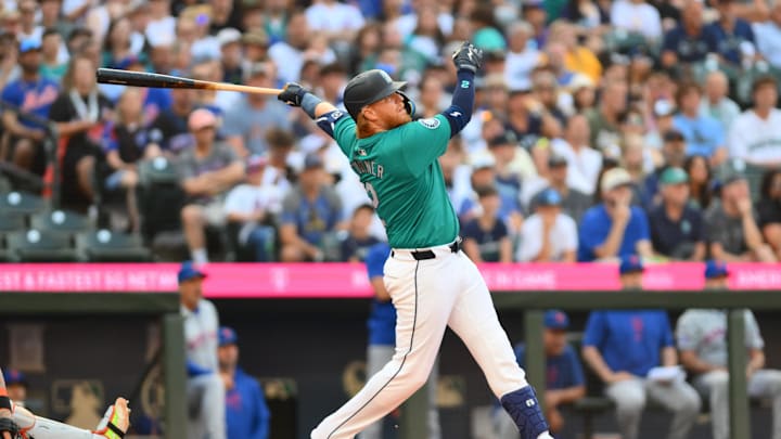 Seattle Mariners first baseman Justin Turner (2) hits an RBI double against the New York Mets during the first inning at T-Mobile Park in 2024.