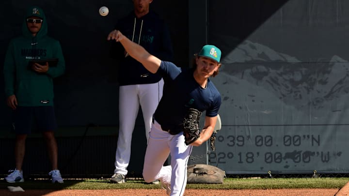 Feb 12, 2026; Peoria, AZ, USA;  Seattle Mariners pitcher Bryce Miller (50) throws during a Spring Training workout at Peoria Sports Complex. Mandatory Credit: Matt Kartozian-Imagn Images