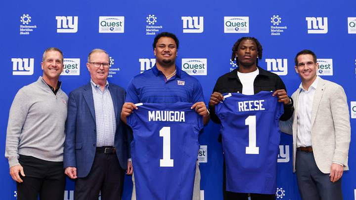 Apr 24, 2026; East Rutherford, NJ, USA; New York Giants draft picks Francis Mauigoa and Arvell Reese, Head Coach John Harbaugh (far left), Owner John Mara (left) and General Manager Joe Schoen (right) pose for a photo during the introductory press conference at Quest Diagnostics Training Center.  