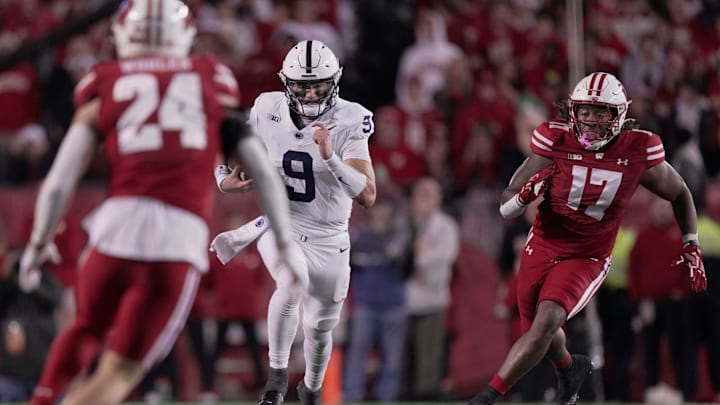 Penn State quarterback Beau Pribula runs for a first down during the third quarter against Wisconsin at Camp Randall Stadium .