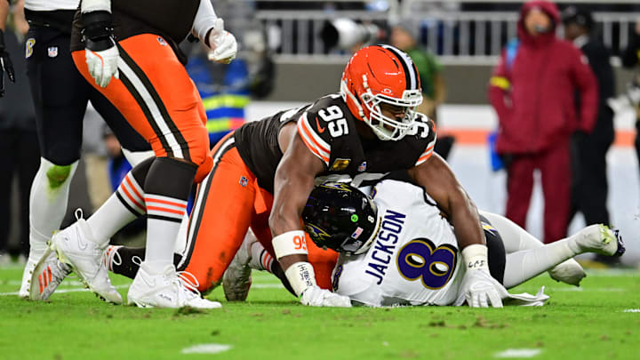 Nov 16, 2025; Cleveland, Ohio, USA; Cleveland Browns defensive end Myles Garrett (95) reacts after sacking Baltimore Ravens quarterback Lamar Jackson (8) during the second quarter at Huntington Bank Field. Mandatory Credit: Ken Blaze-Imagn Images