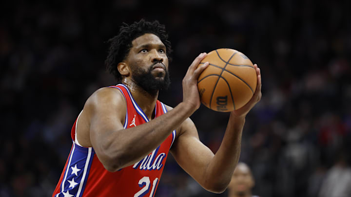 Feb 7, 2025; Detroit, Michigan, USA;  Philadelphia 76ers center Joel Embiid (21) shoots in the first half against the Detroit Red Wings at Little Caesars Arena. Mandatory Credit: Rick Osentoski-Imagn Images