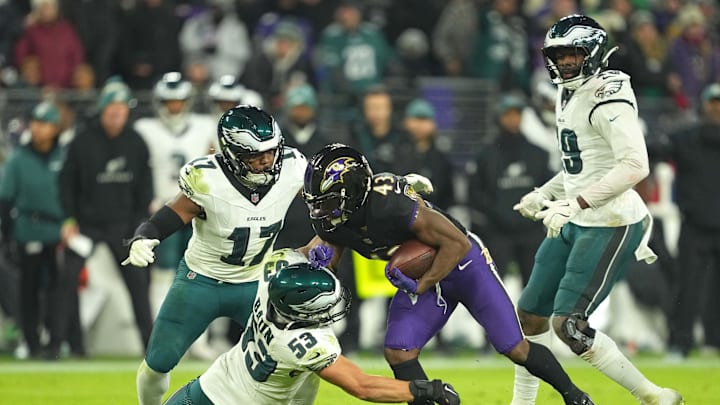 Dec 1, 2024; Baltimore, Maryland, USA; Baltimore Ravens running back Justice Hill (43) runs for a third quarter gain defended by Philadelphia Eagles linebacker Zack Baun (53) at M&T Bank Stadium. Mandatory Credit: Mitch Stringer-Imagn Images Dec 1, 2024; Baltimore, Maryland, USA; Baltimore Ravens running back Justice Hill (43) runs for a third quarter gain defended by Philadelphia Eagles linebacker Zack Baun (53) at M&T Bank Stadium. Mandatory Credit: Mitch Stringer-Imagn Images
