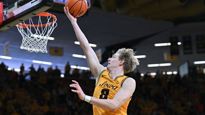 Jan 11, 2026; Iowa City, Iowa, USA; Iowa Hawkeyes forward Cooper Koch (8) goes to the basket against the Illinois Fighting Illini during the second half at Carver-Hawkeye Arena. Mandatory Credit: Jeffrey Becker-Imagn Images Jan 11, 2026; Iowa City, Iowa, USA; Iowa Hawkeyes forward Cooper Koch (8) goes to the basket against the Illinois Fighting Illini during the second half at Carver-Hawkeye Arena. Mandatory Credit: Jeffrey Becker-Imagn Images