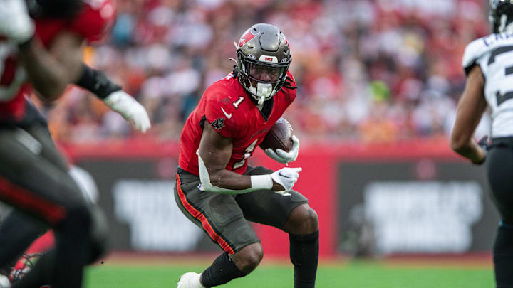 Dec 24, 2023; Tampa, Florida, USA; Tampa Bay Buccaneers running back Rachaad White (1) runs the ball