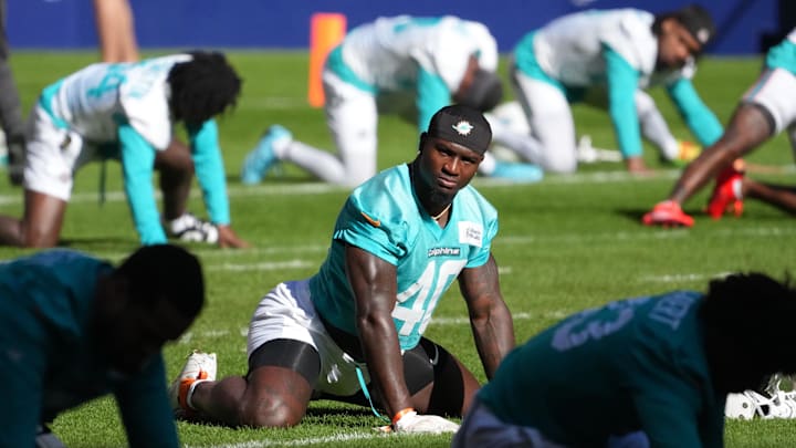Nov 12, 2025; Madrid, Spain; Miami Dolphins linebacker Willie Gay Jr. (40) stretches during practice at Estadio Riyadh Air Metropolitano. 
