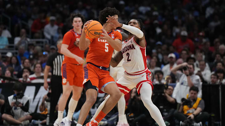 Mar 28, 2024; Los Angeles, CA, USA; Clemson Tigers forward Jack Clark (5) controls the ball against Arizona Wildcats guard Caleb Love (2) in the first half in the semifinals of the West Regional of the 2024 NCAA Tournament at Crypto.com Arena. Mandatory Credit: Kirby Lee-USA TODAY Sports