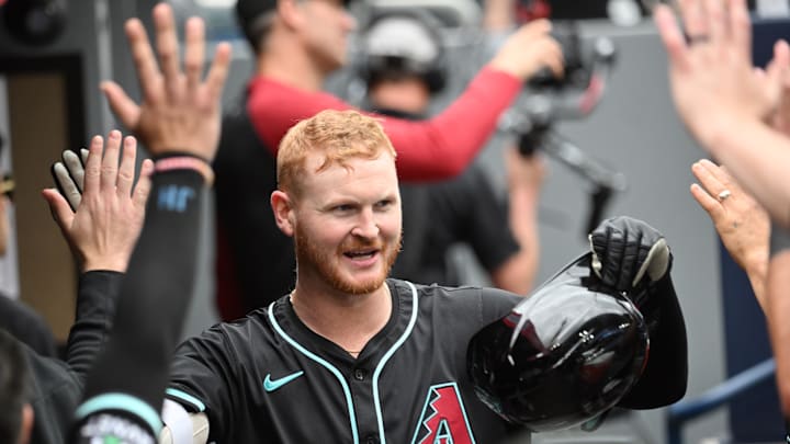 Arizona Diamondbacks first baseman Pavin Smith (26) celebrates with team mates in the dugout after hitting a two run home run against the Toronto Blue Jays in the fifth inning at Rogers Centre. 