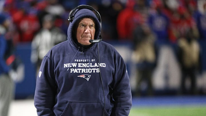 New England Patriots head coach Bill Belichick walks on the sideline during an NFL game. New England Patriots head coach Bill Belichick walks on the sideline during an NFL game.