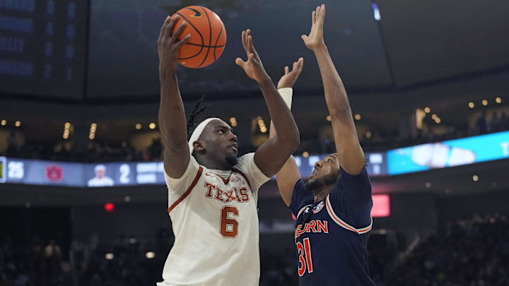 Jan 7, 2025; Austin, Texas, USA; Texas Longhorns forward Arthur Kaluma (6) shoots over Auburn Tigers forward Chaney Johnson (31) during the first half at Moody Center. Mandatory Credit: Scott Wachter-Imagn Images