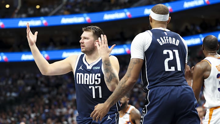 Nov 8, 2024; Dallas, Texas, USA; Dallas Mavericks guard Luka Doncic (77) reacts in front of Dallas Mavericks center Daniel Gafford (21) during the first quarter against the Phoenix Suns at American Airlines Center. Mandatory Credit: Kevin Jairaj-Imagn Images