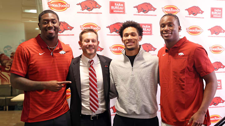 Dec 4, 2025; Fayetteville, AR, USA; Arkansas Razorbacks defensive end Quincy Rhodes Jr, head coach Ryan Silverfield, wide receiver CJ Brown, and quarterback KJ Jackson during the introductory press conference for Silverfield at Frank Broyles Center. Mandatory Credit: Nelson Chenault-Imagn Images Dec 4, 2025; Fayetteville, AR, USA; Arkansas Razorbacks defensive end Quincy Rhodes Jr, head coach Ryan Silverfield, wide receiver CJ Brown, and quarterback KJ Jackson during the introductory press conference for Silverfield at Frank Broyles Center. Mandatory Credit: Nelson Chenault-Imagn Images