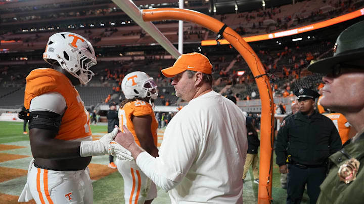 Tennessee football coach Josh Heupel encourages offensive lineman David Sanders Jr. (70) as he returns to the locker room after losing to Vanderbilt in NCAA college football game on Nov. 29, 2025, in Knoxville, Tennessee.