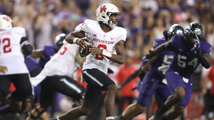 Oct 4, 2024; Fort Worth, Texas, USA; Houston Cougars quarterback Zeon Chriss (2) rolls out to pass in the third quarter against the TCU Horned Frogs at Amon G. Carter Stadium. Mandatory Credit: Tim Heitman-Imagn Images