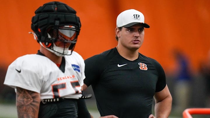 Cincinnati Bengals defensive end Trey Hendrickson (91) assists with drills during a preseason training camp practice in downtown Cincinnati on Thursday, July 31, 2025.
