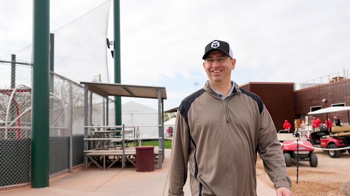 Reds president of baseball operations Nick Krall walks between fields at the Cincinnati Reds Player Development Complex in Goodyear, Ariz., on Wednesday, Feb. 12, 2025.