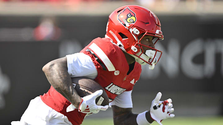 Sep 20, 2025; Louisville, Kentucky, USA;  Louisville Cardinals wide receiver Caullin Lacy (5) returns a kickoff against the Bowling Green Falcons during the first quarter at L&N Federal Credit Union Stadium. Mandatory Credit: Jamie Rhodes-Imagn Images