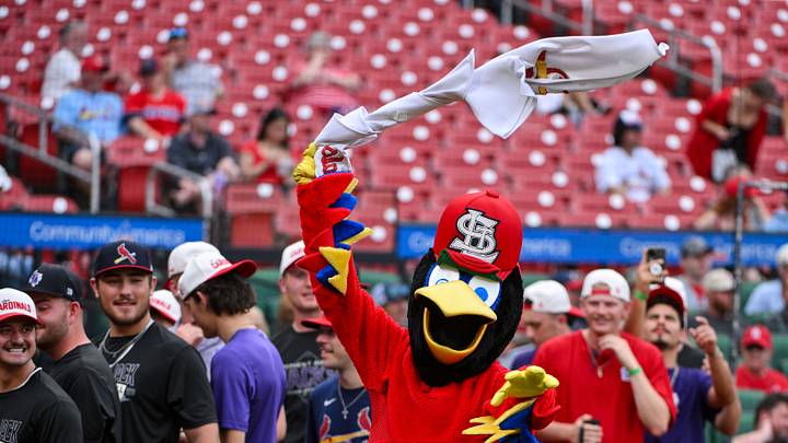 May 19, 2026; St. Louis, Missouri, USA; St. Louis Cardinals mascot Fredbird removes his jersey and celebrates before a ceremonial first pitch from Stephen F. Austin Club baseball player Bryce Bradford who helped start the Tarps Off shirtless fan trend at Busch Stadium before a game against the Pittsburgh Pirates. Mandatory Credit: Jeff Curry-Imagn Images May 19, 2026; St. Louis, Missouri, USA; St. Louis Cardinals mascot Fredbird removes his jersey and celebrates before a ceremonial first pitch from Stephen F. Austin Club baseball player Bryce Bradford who helped start the Tarps Off shirtless fan trend at Busch Stadium before a game against the Pittsburgh Pirates. Mandatory Credit: Jeff Curry-Imagn Images