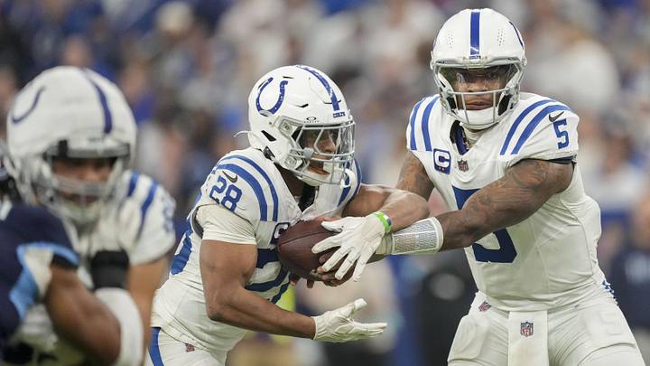 Dec 22, 2024; Indianapolis, Indiana, USA; Indianapolis Colts quarterback Anthony Richardson (5) hands the ball off to Indianapolis Colts running back Jonathan Taylor (28) during a game against the Tennessee Titans  at Lucas Oil Stadium. Mandatory Credit: Grace Hollars/USA Today Network via Imagn Images 