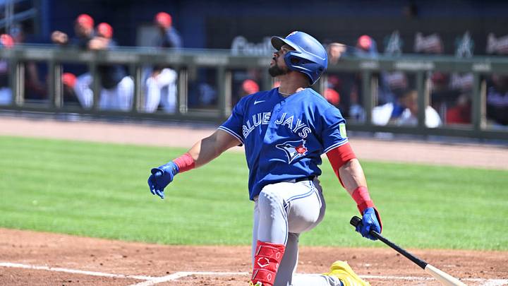 Mar 5, 2026; North Port, Florida, USA; Toronto Blue Jays left fielder Jonatan Clase (8) hits a sacrifice fly ball in the second  inning against the Atlanta Braves during spring training  at CoolToday Park. Mandatory Credit: Jonathan Dyer-Imagn Images
