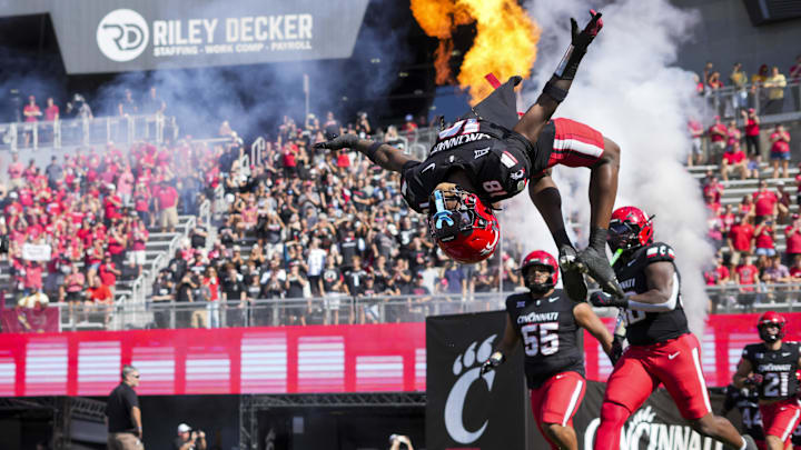 Oct 4, 2025; Cincinnati, Ohio, USA;  Cincinnati Bearcats safety Marqavious Saboor (18) does a flip during player introductions before the game against the Iowa State Cyclones at Nippert Stadium. Mandatory Credit: Aaron Doster-Imagn Images