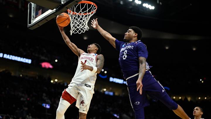Mar 21, 2026; Portland, OR, USA; Arkansas Razorbacks guard Meleek Thomas (1) shoots against High Point Panthers forward Owen Aquino (8) in the second half during a second round game of the men's 2026 NCAA Tournament at Moda Center. Mandatory Credit: Troy Wayrynen-Imagn Images Mar 21, 2026; Portland, OR, USA; Arkansas Razorbacks guard Meleek Thomas (1) shoots against High Point Panthers forward Owen Aquino (8) in the second half during a second round game of the men's 2026 NCAA Tournament at Moda Center. Mandatory Credit: Troy Wayrynen-Imagn Images