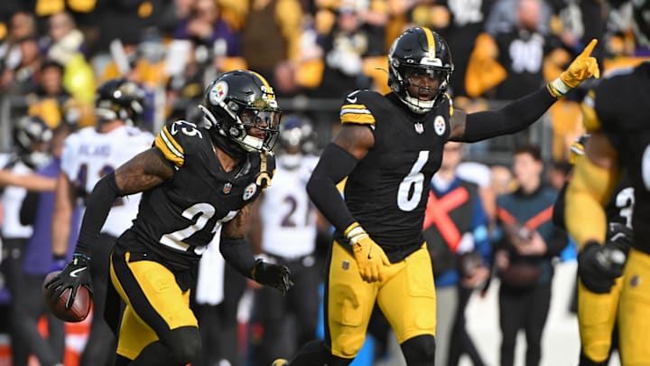 Nov 17, 2024; Pittsburgh, Pennsylvania, USA; Pittsburgh Steelers defenders DeShon Elliott (25) and Patrick Queen (6) celebrate a fumble recovery against the Baltimore Ravens during the first quarter at Acrisure Stadium. Mandatory Credit: Barry Reeger-Imagn Images
