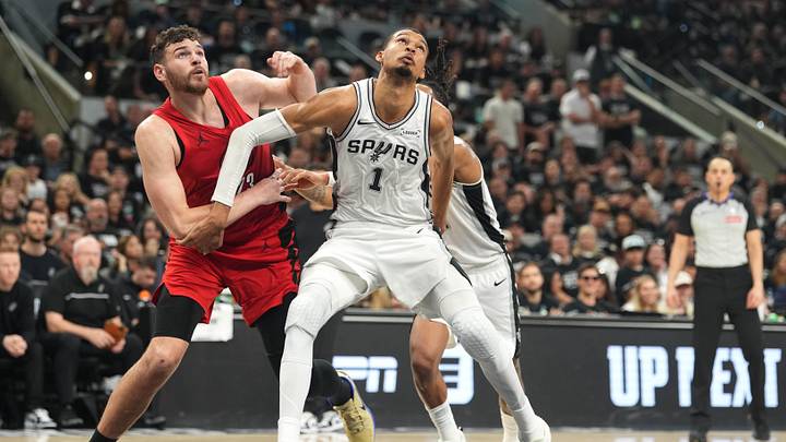 San Antonio Spurs forward Victor Wembanyama boxes out Portland Trail Blazers center Donovan Clingan.