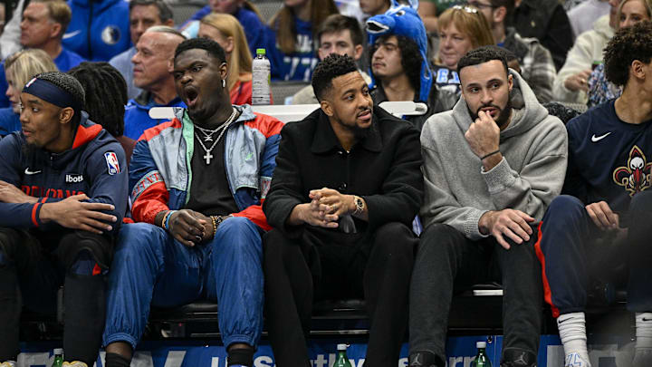 New Orleans Pelicans forward Zion Williamson and guard CJ McCollum watch the game against the Dallas Mavericks at American Airlines Center. New Orleans Pelicans forward Zion Williamson and guard CJ McCollum watch the game against the Dallas Mavericks at American Airlines Center.