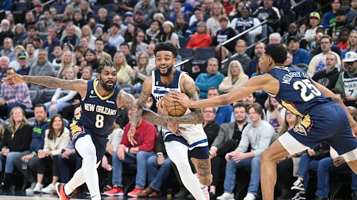 Apr 9, 2023; Minneapolis, Minnesota, USA; Minnesota Timberwolves guard Nickeil Alexander-Walker (9) goes to the basket as New Orleans Pelicans forward Naji Marshall (8) and guard Trey Murphy III (25) defend during the second quarter at Target Center. Mandatory Credit: Jeffrey Becker-Imagn Images