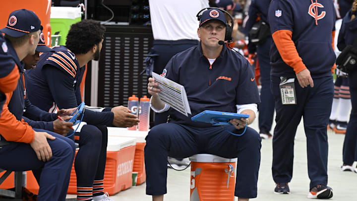 Sep 29, 2024; Chicago, Illinois, USA;  Chicago Bears quarterback Caleb Williams (18) and offensive coordinator Shane Waldron chat during the first half against the Los Angeles Rams at Soldier Field. Mandatory Credit: Matt Marton-Imagn Images