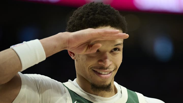 Milwaukee Bucks guard Ryan Rollins (13) salutes a fan during the first half against the Portland Trail Blazers at Moda Center on March 25, 2026.