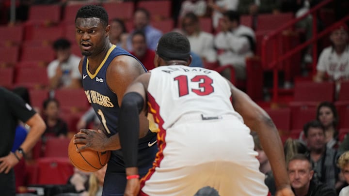 Mar 22, 2024; Miami, Florida, USA;  New Orleans Pelicans forward Zion Williamson (1) looks to pass th ball as Miami Heat center Bam Adebayo (13) defends during the first half at Kaseya Center. Mandatory Credit: Jim Rassol-Imagn Images