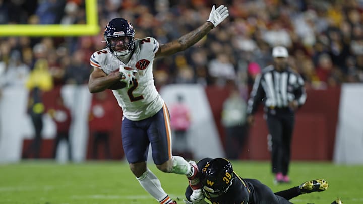 Oct 13, 2025; Landover, Maryland, USA; Chicago Bears wide receiver DJ Moore (2) escapes the tackle of Washington Commanders safety Jeremy Reaves (39) during the first quarter at Northwest Stadium. Mandatory Credit: Peter Casey-Imagn Images Oct 13, 2025; Landover, Maryland, USA; Chicago Bears wide receiver DJ Moore (2) escapes the tackle of Washington Commanders safety Jeremy Reaves (39) during the first quarter at Northwest Stadium. Mandatory Credit: Peter Casey-Imagn Images