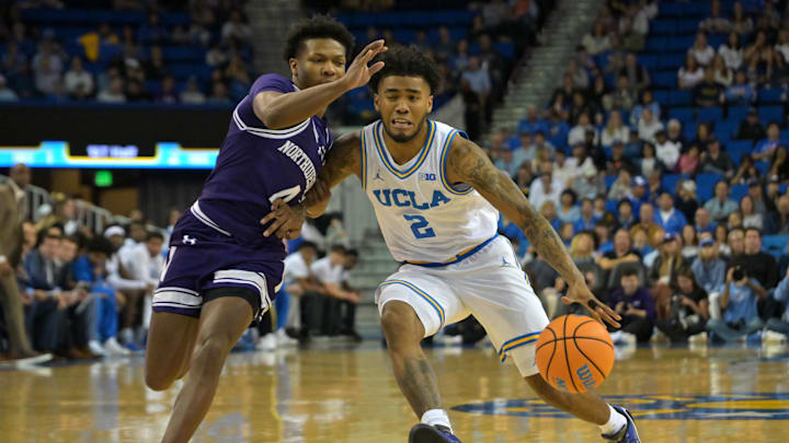 Jan 24, 2026; Los Angeles, California, USA; Northwestern Wildcats guard Jayden Reid (4) UCLA Bruins guard Donovan Dent (2) as he drives to the basket in the first half at Pauley Pavilion presented by Wescom Financial. Mandatory Credit: Jayne Kamin-Oncea-Imagn Images Jan 24, 2026; Los Angeles, California, USA; Northwestern Wildcats guard Jayden Reid (4) UCLA Bruins guard Donovan Dent (2) as he drives to the basket in the first half at Pauley Pavilion presented by Wescom Financial. Mandatory Credit: Jayne Kamin-Oncea-Imagn Images