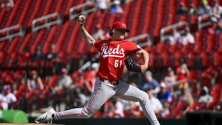 Jun 21, 2025; St. Louis, Missouri, USA;  Cincinnati Reds relief pitcher Chase Petty (61) pitches against the St. Louis Cardinals during the eleventh inning at Busch Stadium. Mandatory Credit: Jeff Curry-Imagn Images