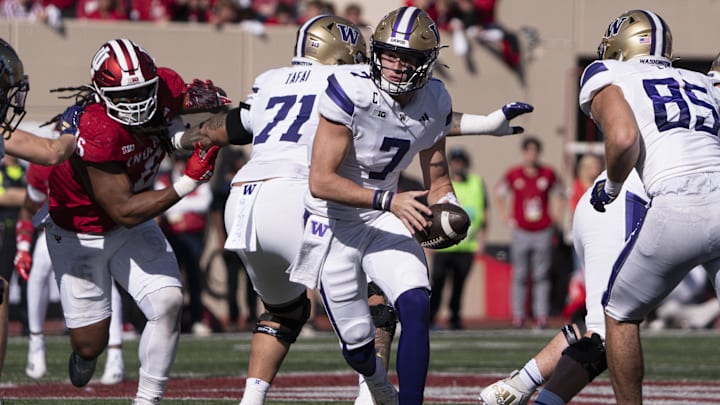 Oct 26, 2024; Bloomington, Indiana, USA; Washington Huskies quarterback Will Rogers III (7) hands the ball off during the second quarter of a game against the Indiana Hoosiers at Memorial Stadium. Mandatory Credit: Jacob Musselman-Imagn Images