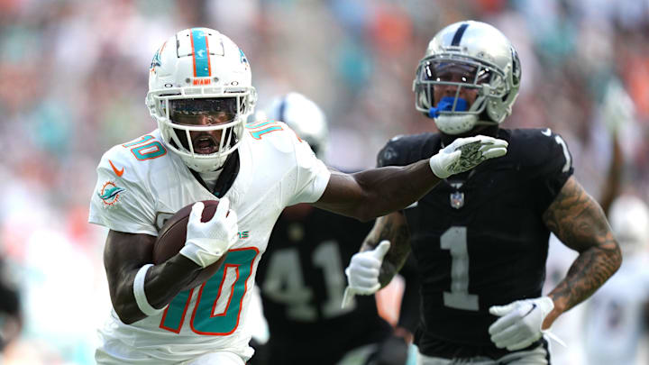 Miami Dolphins wide receiver Tyreek Hill (10) runs past Las Vegas Raiders safety Marcus Epps (1) and scores a touchdown during the first half of an NFL game at Hard Rock Stadium in Miami Gardens, Nov. 19, 2023. Miami Dolphins wide receiver Tyreek Hill (10) runs past Las Vegas Raiders safety Marcus Epps (1) and scores a touchdown during the first half of an NFL game at Hard Rock Stadium in Miami Gardens, Nov. 19, 2023.