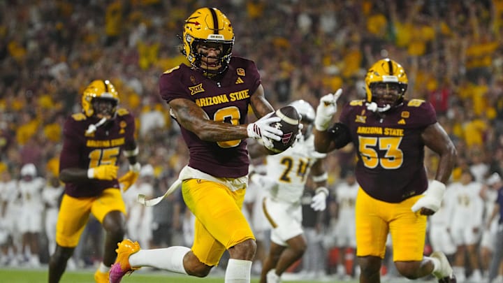 Arizona State wide receiver Jordyn Tyson (0) scores a touchdown against NAU during a game at Mountain America Stadium in Tempe on Aug. 30, 2025.