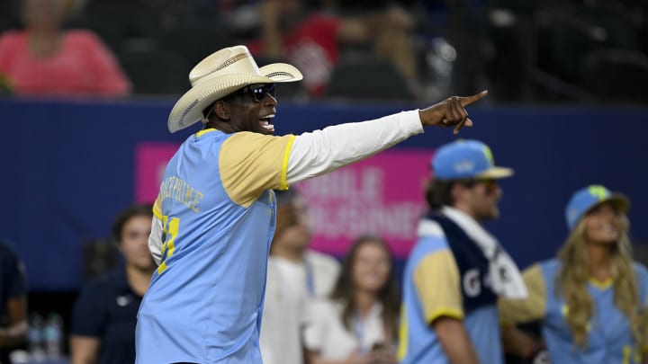 Colorado Buffalos head coach and former MLB and NFL player Deion Sanders of the National League motions to his team during the 2024 All Star Celebrity Softball Game at Globe Life Field on July 13.