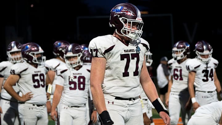 Waterloo West's Carson Nielsen warms up on the sideline during the West Des Moines Valley and Waterloo West football game at Valley Stadium on Friday, Oct. 11, 2024, in West Des Moines.