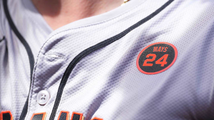 San Francisco Giants team members wear a patch to honor longtime player Willie Mays during action against the Baltimore Orioles at Oriole Park at Camden Yards on Sept 19. 