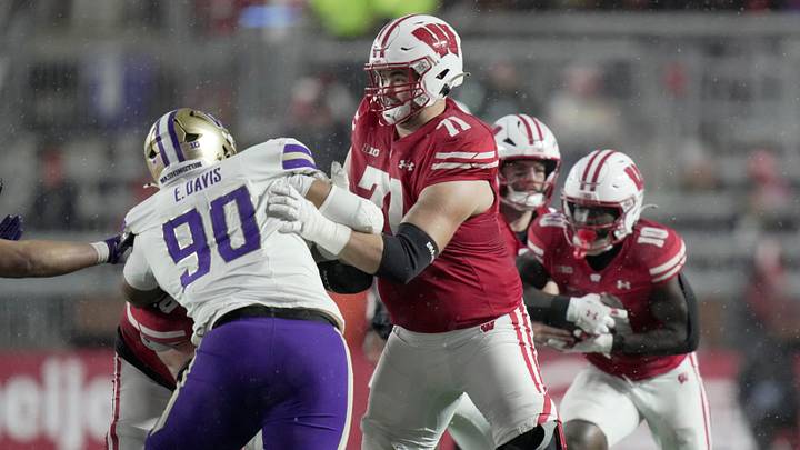 Wisconsin offensive lineman Riley Mahlman (71) blocks for running back Gideon Ituka (10) during the third quarter of their game Saturday, November 8, 2025 at Camp Randall Stadium in Madison, Wisconsin. Wisconsin beat Washington 13-10.