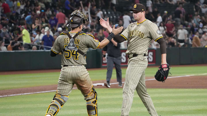 Aug 6, 2025; Phoenix, Arizona, USA; San Diego Padres catcher Freddy Fermin (54) and San Diego Padres pitcher Mason Miller (22) celebrate against the Arizona Diamondbacks after the ninth inning at Chase Field. Mandatory Credit: Joe Camporeale-Imagn Images