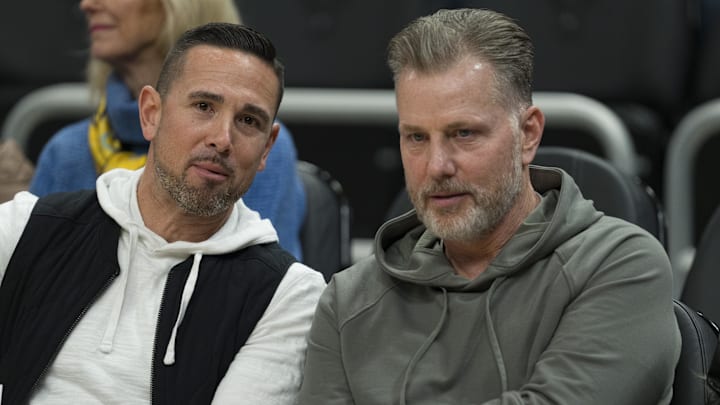 Mar 6, 2024; Milwaukee, Wisconsin, USA;  Green Bay Packers head coach Matt LaFleur and Chicago Bears head coach Matt Eberflus talk while sitting courtside prior to the game between the Connecticut Huskies and Marquette Golden Eagles at Fiserv Forum. Mandatory Credit: Jeff Hanisch-USA TODAY Sports