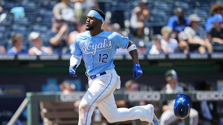 Jul 29, 2021; Kansas City, Missouri, USA; Kansas City Royals right fielder Jorge Soler (12) loses his helmet on his way to score against the Chicago White Sox during the fifth inning at Kauffman Stadium. Mandatory Credit: Jay Biggerstaff-Imagn Images