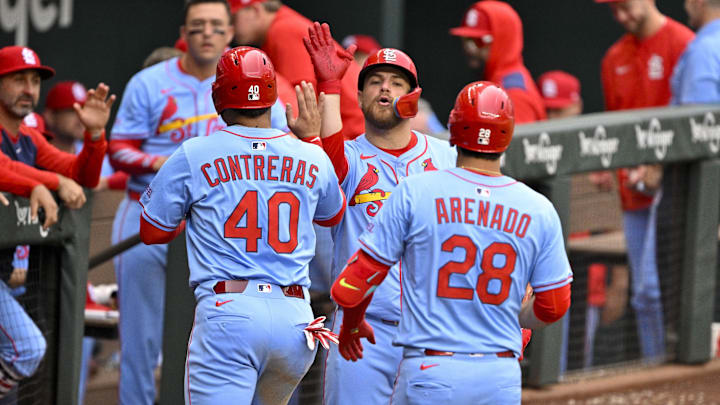 May 31, 2025; Arlington, Texas, USA; St. Louis Cardinals catcher Pedro Pages (43) and first baseman Willson Contreras (40) and third baseman Nolan Arenado (28) celebrate after Arenado hits a sacrifice fly to drive in Contreras during the second inning against the Texas Rangers at Globe Life Field. Mandatory Credit: Jerome Miron-Imagn Images