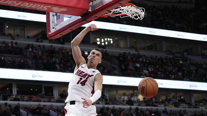 Apr 16, 2025; Chicago, Illinois, USA; Miami Heat guard Tyler Herro (14) dunks the ball against the Chicago Bulls during the second half at United Center. Mandatory Credit: David Banks-Imagn Images