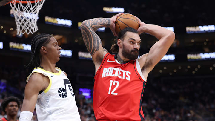 Oct 7, 2024; Salt Lake City, Utah, USA; Houston Rockets center Steven Adams (12) rebounds the ball against Utah Jazz forward Cody Williams (5) during the second quarter at Delta Center. Mandatory Credit: Rob Gray-Imagn Images Oct 7, 2024; Salt Lake City, Utah, USA; Houston Rockets center Steven Adams (12) rebounds the ball against Utah Jazz forward Cody Williams (5) during the second quarter at Delta Center. Mandatory Credit: Rob Gray-Imagn Images